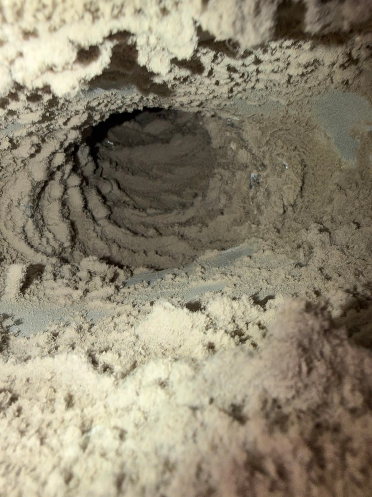 Buildup visible inside a vent