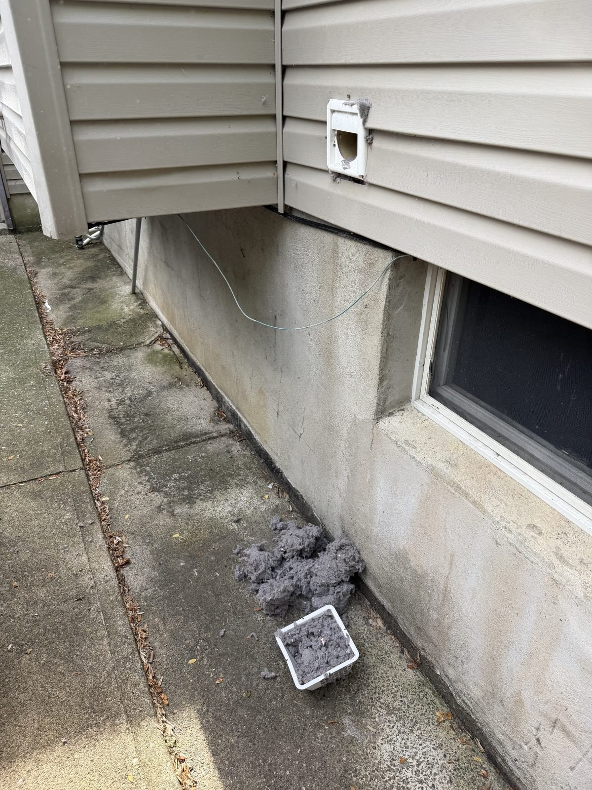 An exterior wall vent serviced by AMG