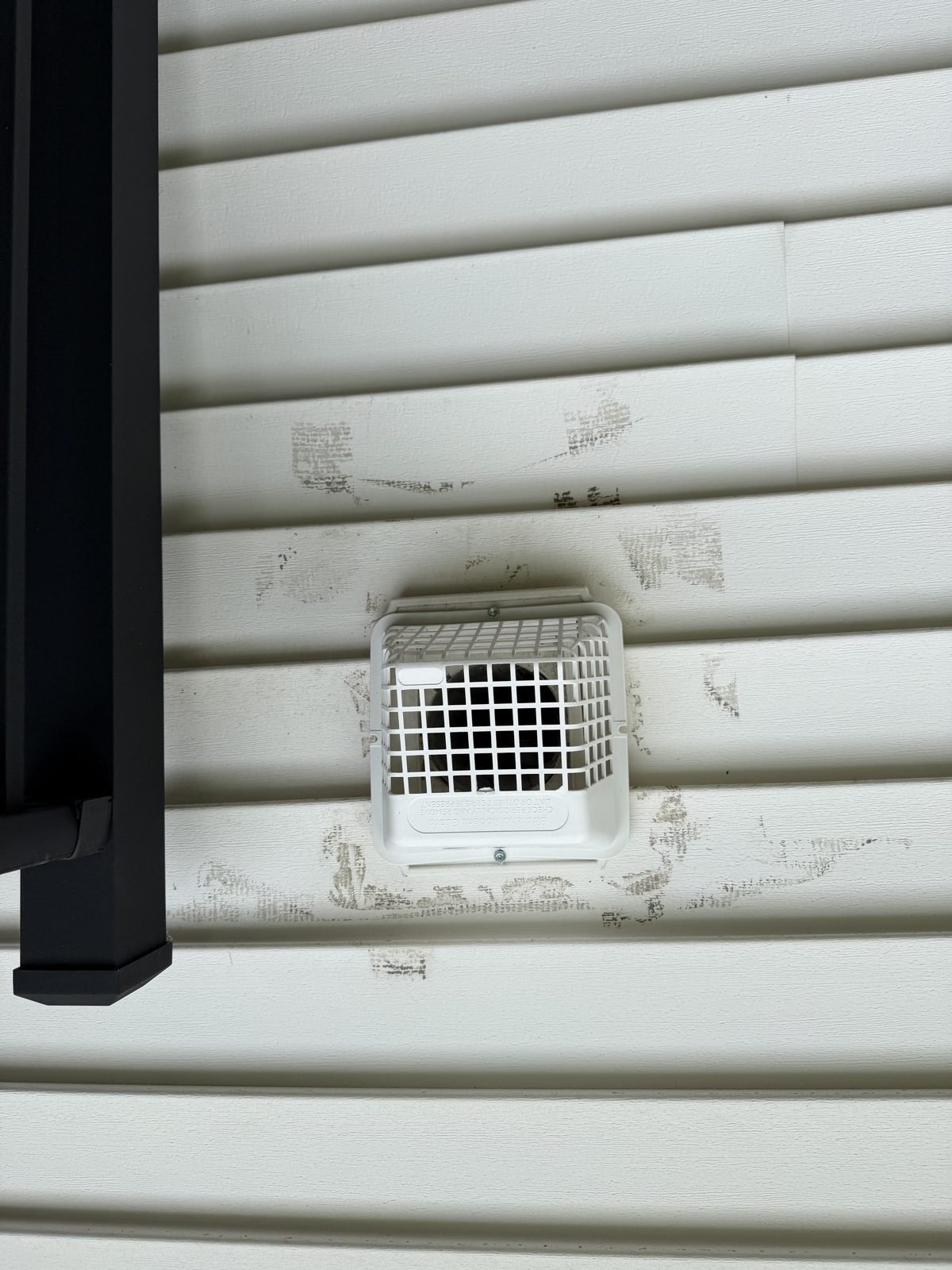 An exterior dryer vent cap on a New Jersey home
