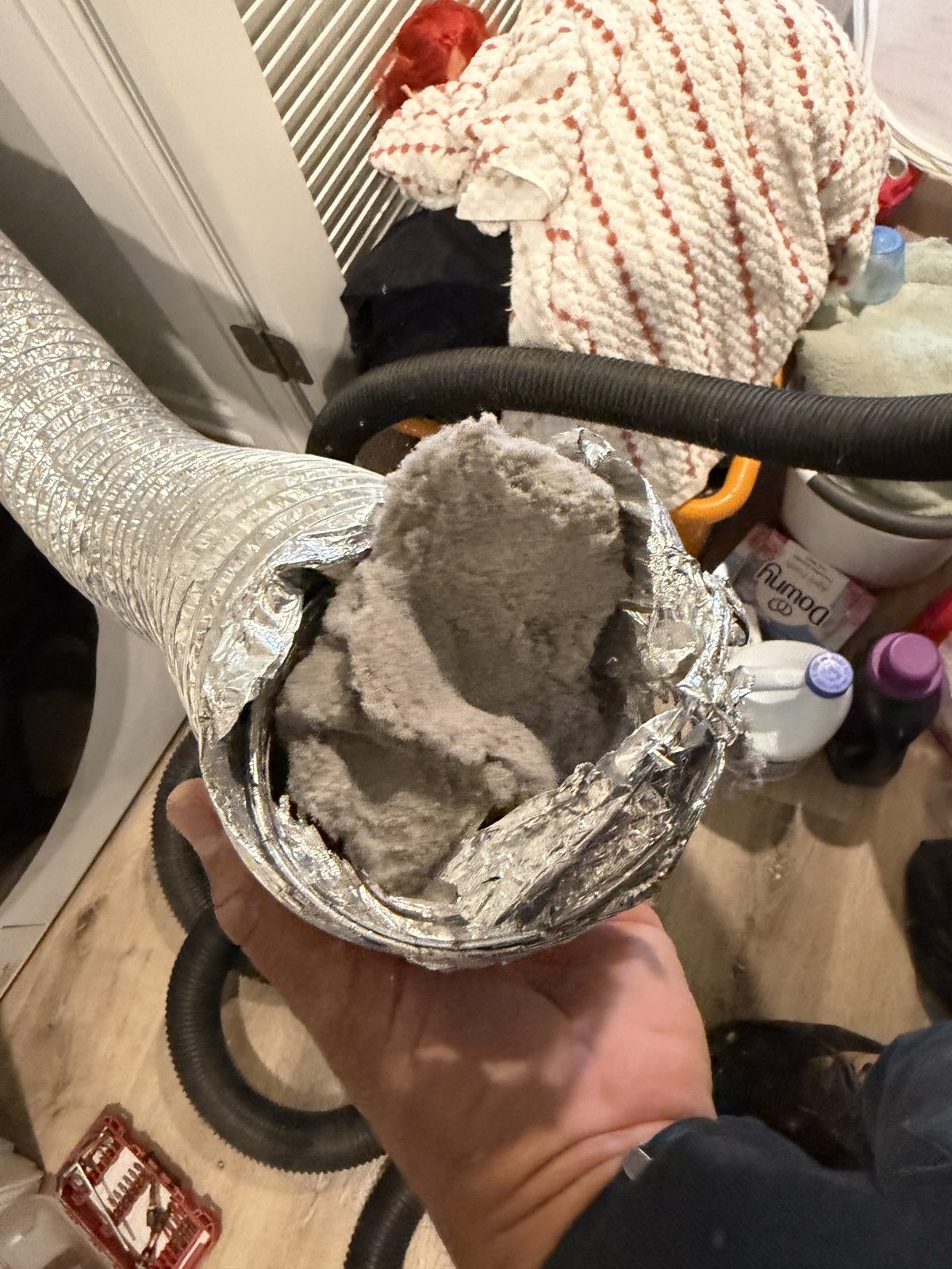A lint packed dryer hose removed by AMG