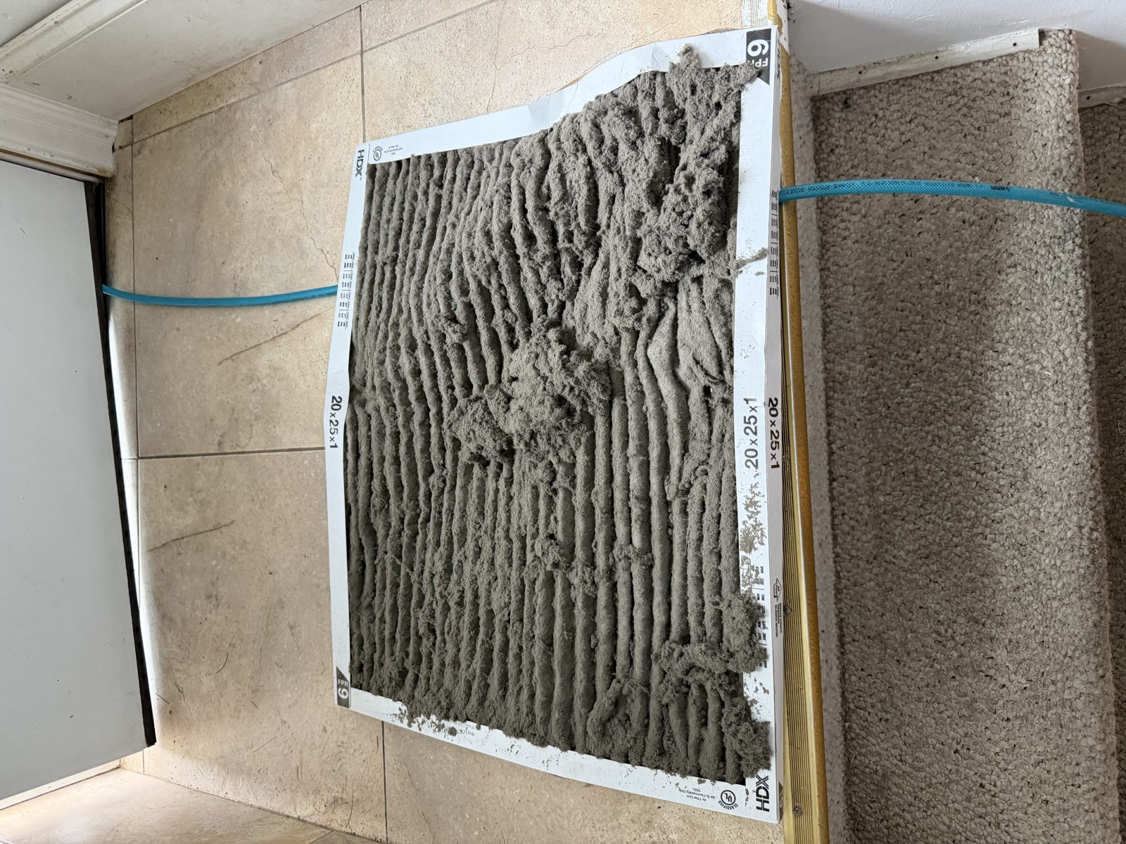 A dust caked return filter before AMG cleaning