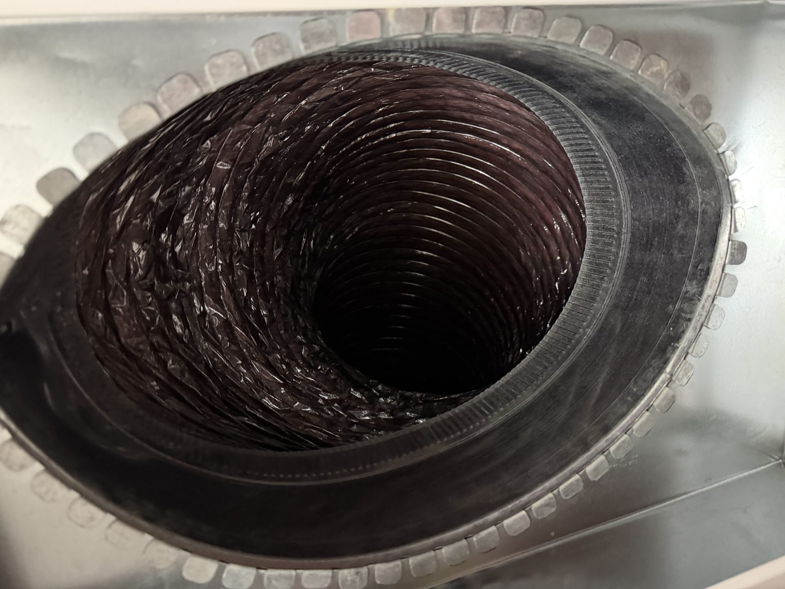 A flexible duct run cleaned by AMG